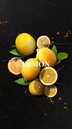 lemons and oranges with leaves on a black background, the word lemon written in white