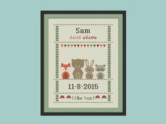 a cross stitch pattern with two animals and a baby's birth date on it