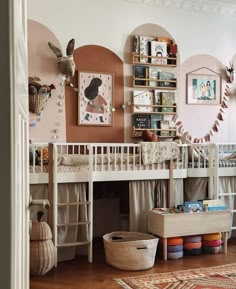 a baby's room with bunk beds and toys