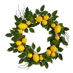 a wreath made out of lemons and green leaves on a white background with measurements