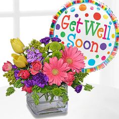 get well soon bouquet with balloon on table