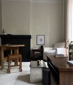 a living room filled with furniture and a fire place