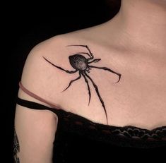 a woman with a spider tattoo on her shoulder