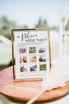 a sign that says where were they? on top of a wooden table with feathers