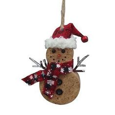 a snowman ornament hanging from a rope