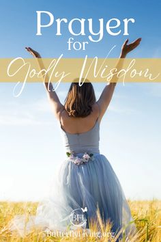 a woman in a blue dress with her hands up and the words prayer for godly vision