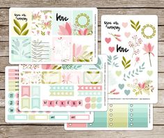 three planner stickers with flowers and hearts on them