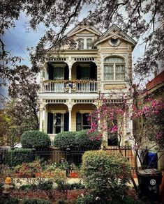 an old house with many windows and balconies