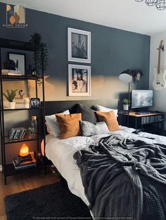 a bedroom with grey walls and pictures on the wall