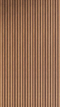 a close up view of the wood grains on a wallpapered surface with vertical stripes