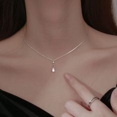 This sparkling, delicate zirconia sits on a pear shaped water drop pendant giving the necklace an elegant touch. The necklace creates a stylish look that can be styled with any outfit. Wear it alone or layered it with our other necklaces. Details 18K Gold Plated on 925 Sterling Silver with zircon stones Chain: 16" + 2" extender Pendant Size: 0.12" by 0.17" Dainty & Fine Delivered in Poppy Mae custom jewelry boxes ready to be gifted Avoid contact with any chemicals or alcohol. Please refer to our Simple Elegant Necklace, Silver Necklace Simple, Pretty Jewelry Necklaces, French Jewelry, Jewelry Lookbook, Teardrop Necklace, Elegant Necklaces, Girly Jewelry, Diamond Pendant Necklace