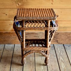 a wicker side table on a wooden floor