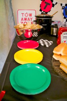 the table is set up with plates and condiments