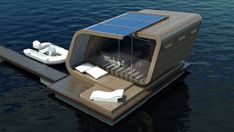 a floating house with solar panels on the roof