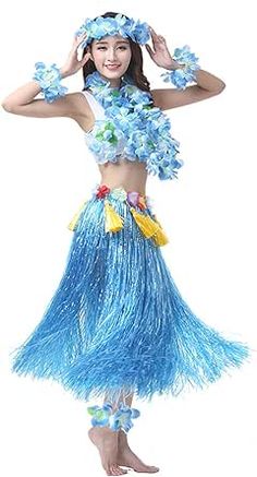 a woman in a blue hula skirt with flowers on her head and hands behind her head