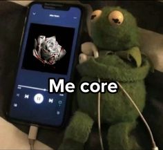 a stuffed animal next to a cell phone with the caption me core on it