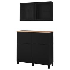 a black cabinet with two doors and a shelf above it on the wall, next to a white background