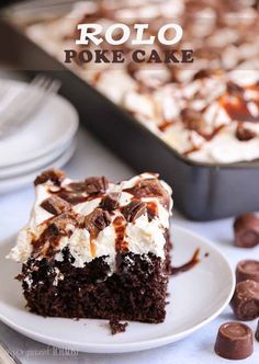 a piece of cake on a plate with chocolate and marshmallows in the background