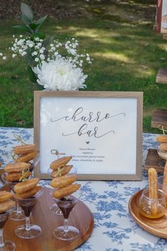 a table topped with desserts and wine glasses