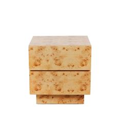 a small wooden box sitting on top of a white surface with brown speckles