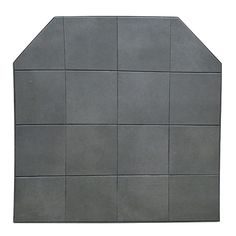 a gray cement wall with squares on the top and bottom, as well as an area for