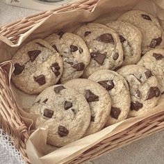 a basket filled with chocolate chip cookies on top of a table