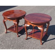 two wooden tables sitting next to each other