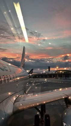 an airplane is sitting on the runway at night with its lights turned on and it's tail lit up