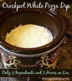 the crockpot white piggy dip is ready to be cooked in the slow cooker