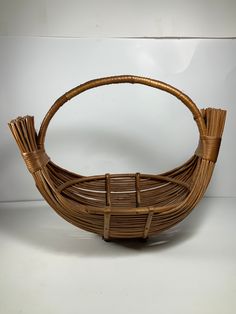 a woven basket sitting on top of a white table