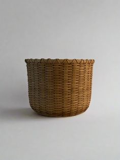 a wicker basket sitting on top of a white table