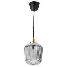 a glass and brass pendant light with a black cord hanging from the ceiling, against a white background