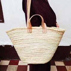 The Moroccan straw basket is handwoven from natural palm leaves.Whether it's for a day at the beach or for a trip to the farmers' marketThis Moroccan straw basket with double leather handle is perfect for carrying your daily essentials,You just found your perfect companio.- Size (Approx): 55 cm x 35 cmPlease note the size can be small about two cm or three cm because it's handmade product.Note: All of our bags are 100% handmade natural palm leaves.Please note: Due to their handmade nature, our M Natural Straw Bag With Double Handle For Market, Natural Double Handle Straw Bag For Market, Beige Basket Straw Bag For Market, Natural Straw Basket Bag With Braided Handles, Natural Basket Straw Bag With Braided Handles, Natural Basket-shaped Straw Bag For Shopping, Natural Basket-shaped Straw Bag, Natural Color Basket-shaped Straw Bag For Shopping, Natural Fiber Basket Straw Bag