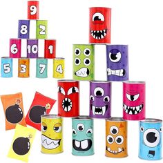 many different colored cans with faces painted on them and numbers arranged in the shape of monsters