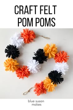 an image of some colorful pom poms on a white background with text overlay