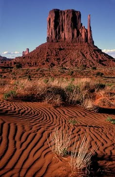 a large rock formation in the middle of a desert