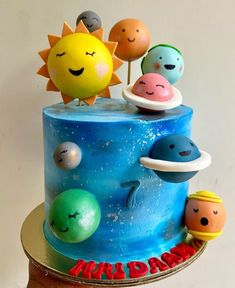 a birthday cake with planets and sun on top