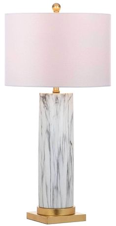 a marble lamp with a gold base and white lampshade on the bottom side