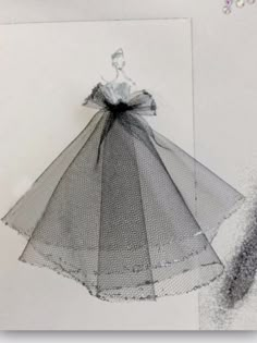 a drawing of a woman in a dress with sequins hanging from it's back