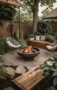 an outdoor fire pit with chairs around it