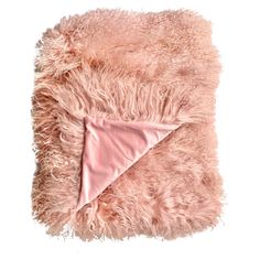 a pink blanket that is laying on top of a white surface with a pink triangle in the middle