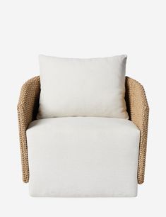 a chair with a white pillow on top of it