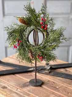 a christmas wreath on top of a wooden table