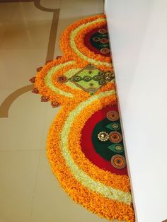 the floor is decorated with orange and yellow flowers