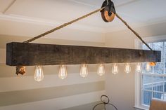 a wooden beam with light bulbs hanging from it