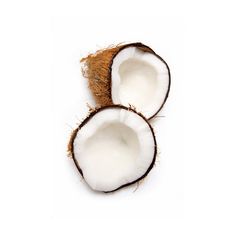 two whole coconuts sitting next to each other on a white surface with one cut in half