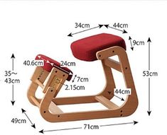 a wooden rocking chair with red seat and measurements