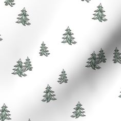 a white and green christmas tree pattern on a plain fabric with very little trees in the background