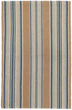 a blue and tan striped rug on a white background