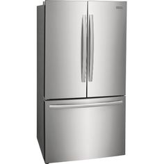 a silver refrigerator freezer sitting next to a white wall